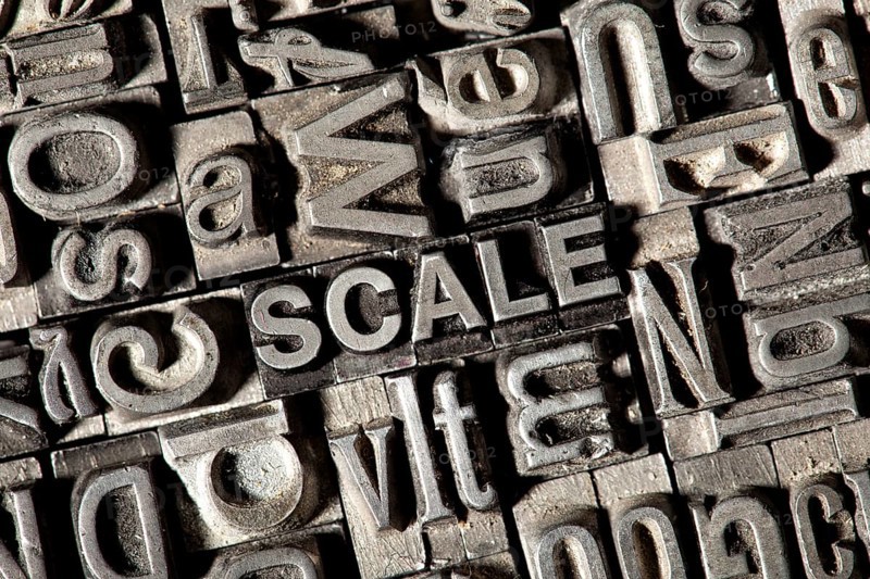 Old lead letters forming the word SCALE