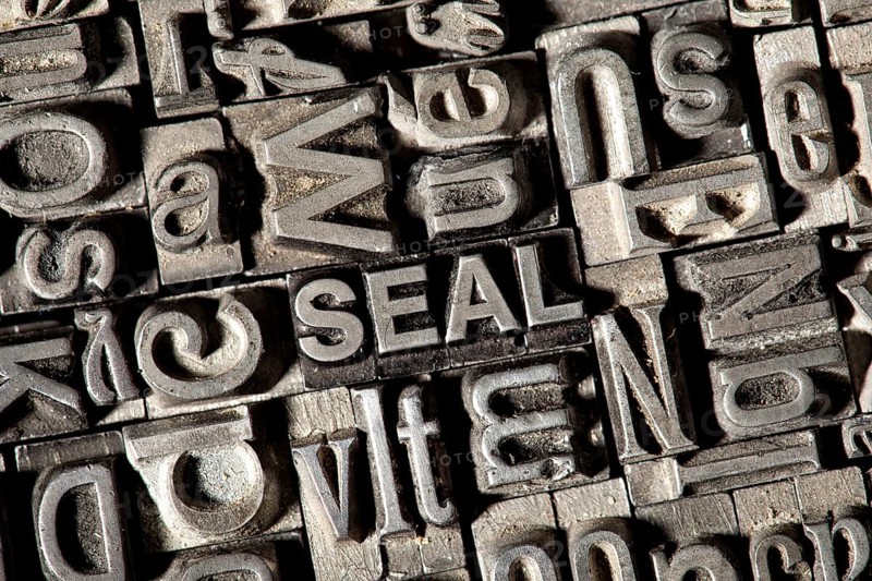 Old lead letters forming the word SEAL