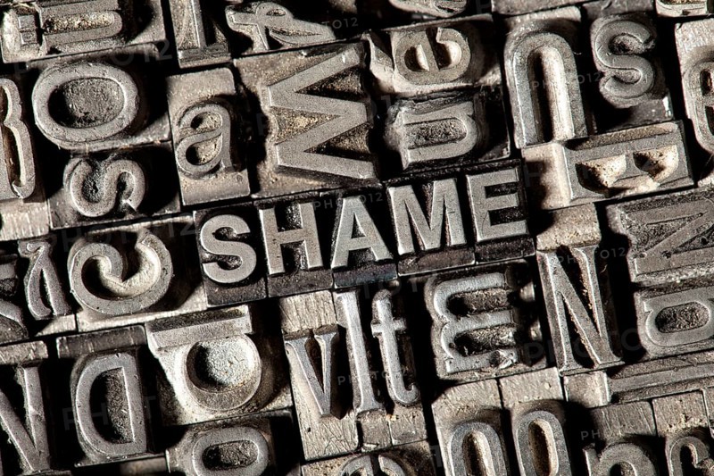 Old lead letters forming the word SHAME