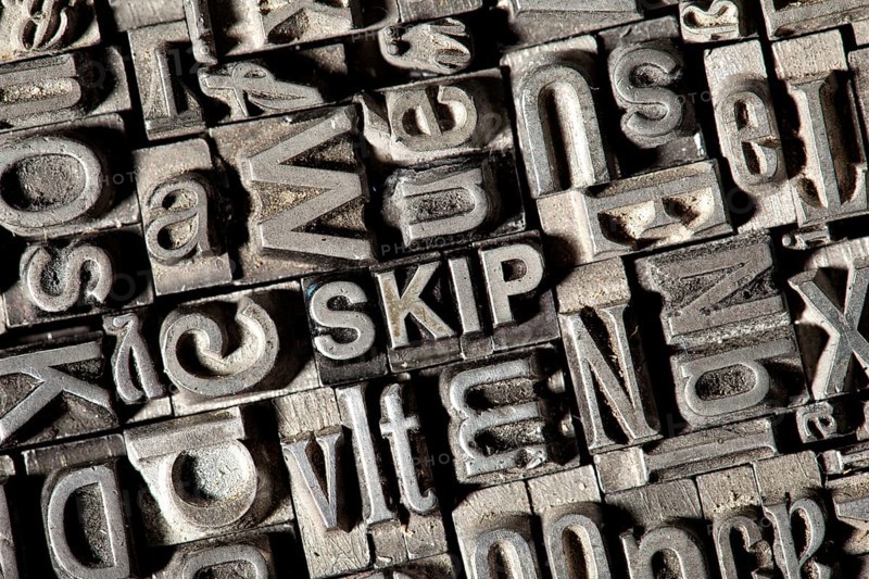 Old lead letters forming the word SKIP