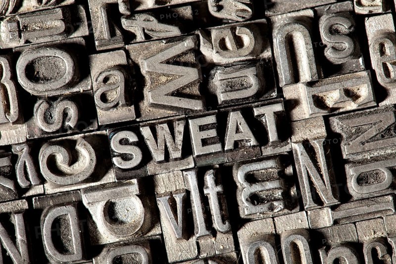 Old lead letters forming the word 'SWEAT'