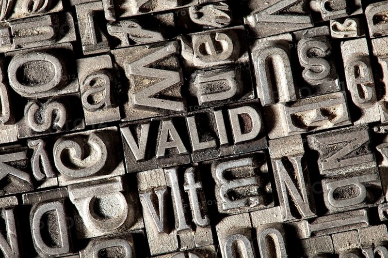 Old lead letters forming the word VALID
