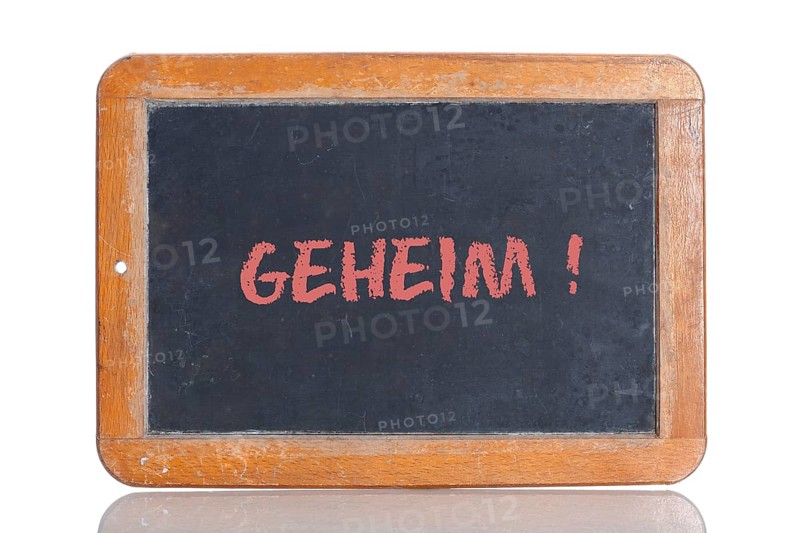Old school blackboard with the word GEHEIM!