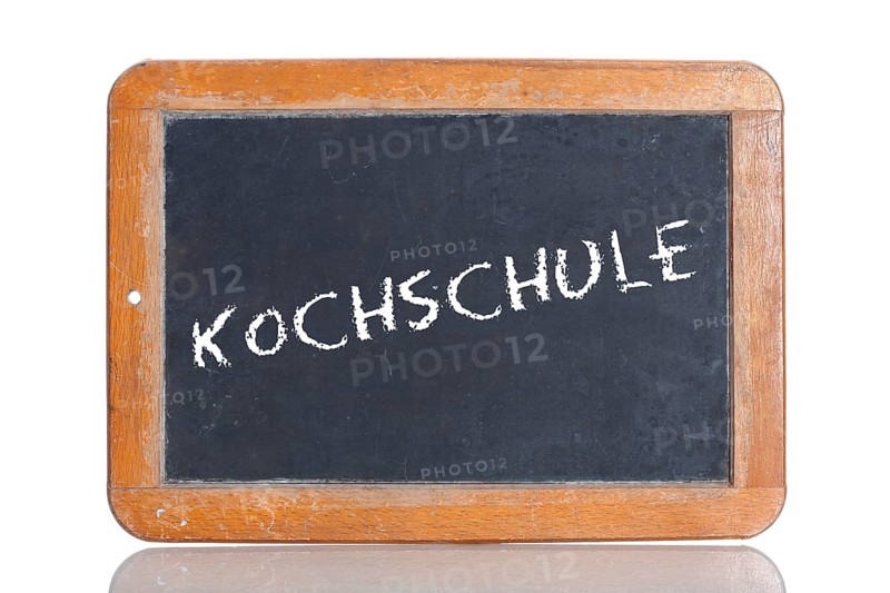 Old school blackboard with the word KOCHSCHULE