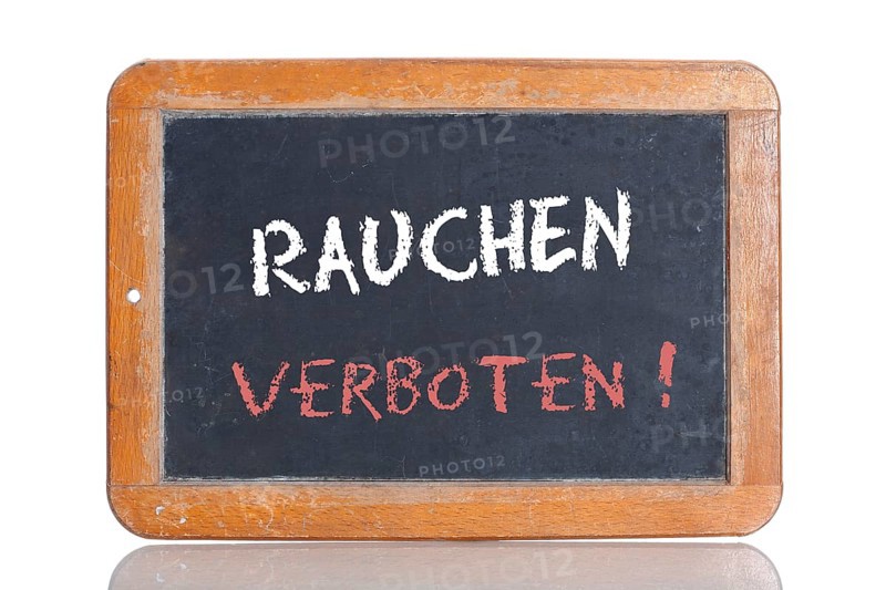 Old school blackboard with the words RAUCHEN VERBOTEN!