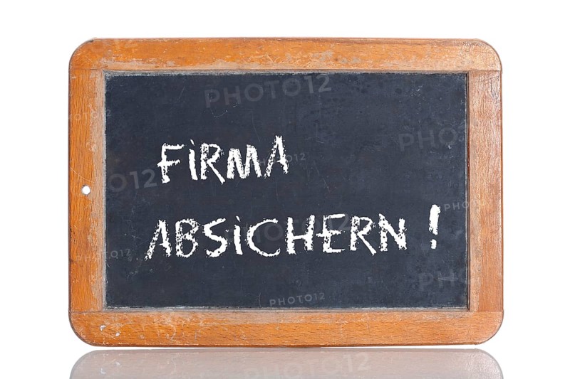 Old school blackboard with the words FIRMA ABSICHERN!