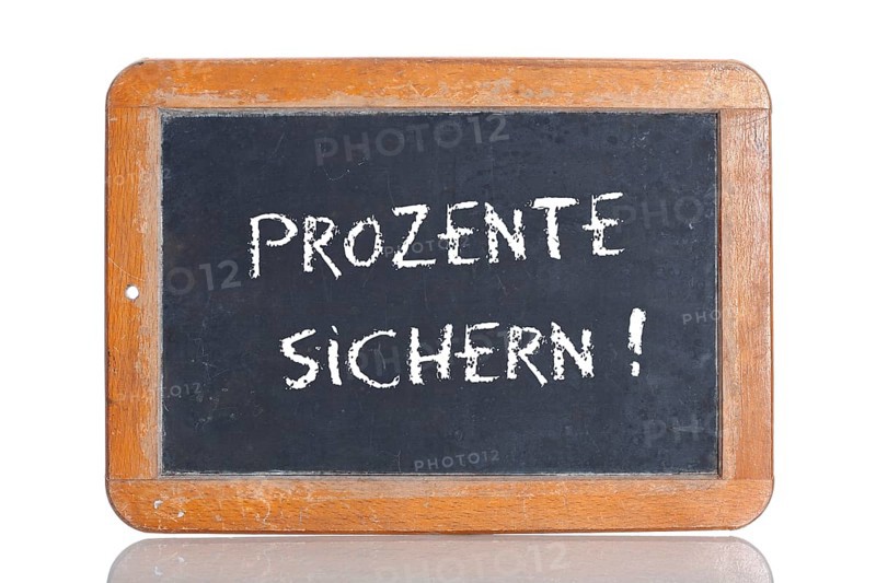 Old school blackboard with the words PROZENTE SICHERN!