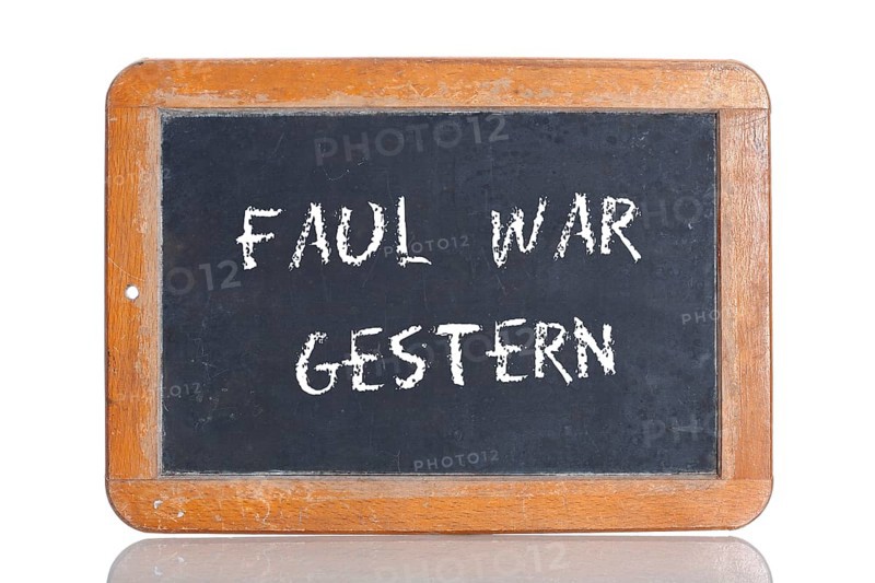 Old school blackboard with the phrase FAUL WAR GESTERN