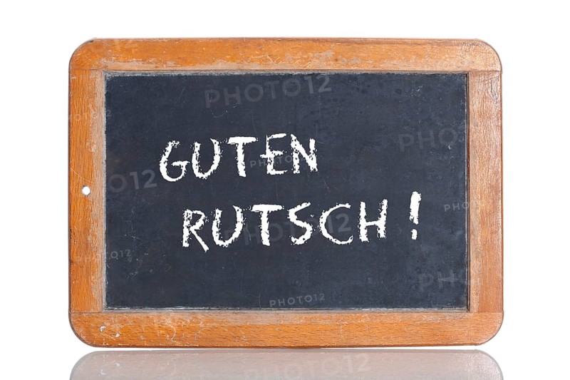 Old school blackboard with the phrase GUTEN RUTSCH!