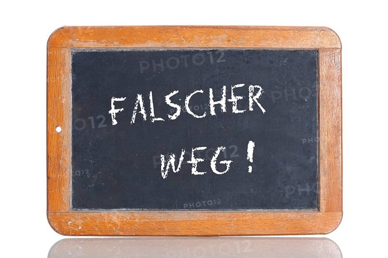 Old school blackboard with the term FALSCHER WEG