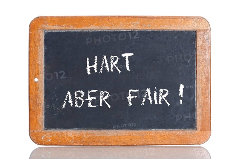 Old school blackboard with the term HART ABER FAIR