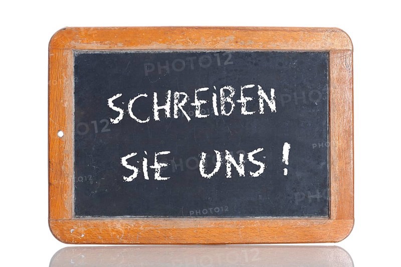 Old school blackboard with the term SCHREIBEN SIE UNS