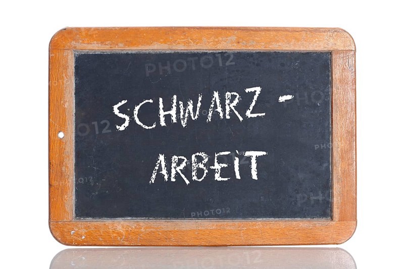 Old school blackboard with the term SCHWARZARBEIT