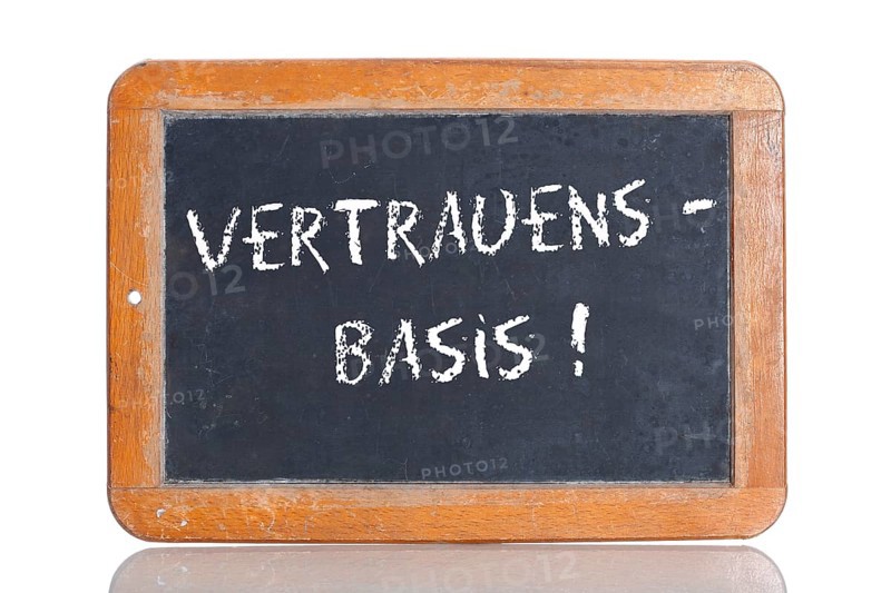 Old school blackboard with the term VERTRAUENSBASIS