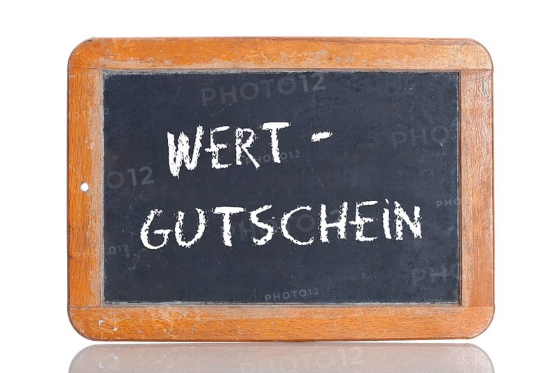 Old school blackboard with the term WERTGUTSCHEIN