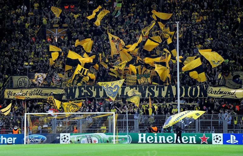 BVB fans in the south stand waving their flags before the start of the game