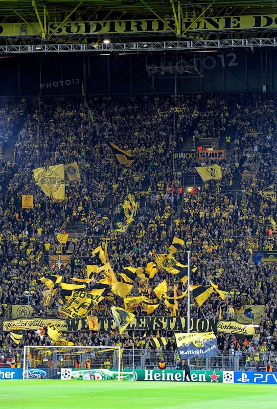 BVB fans in the south stand waving their flags before the start of the game