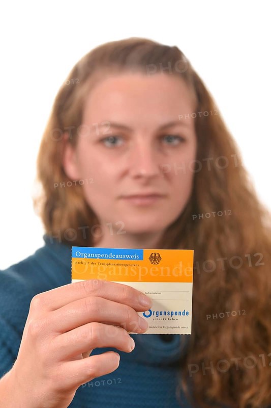 Woman holding an organ donor card