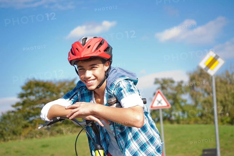 Boy wearing a bike helmet at a traffic awareness course