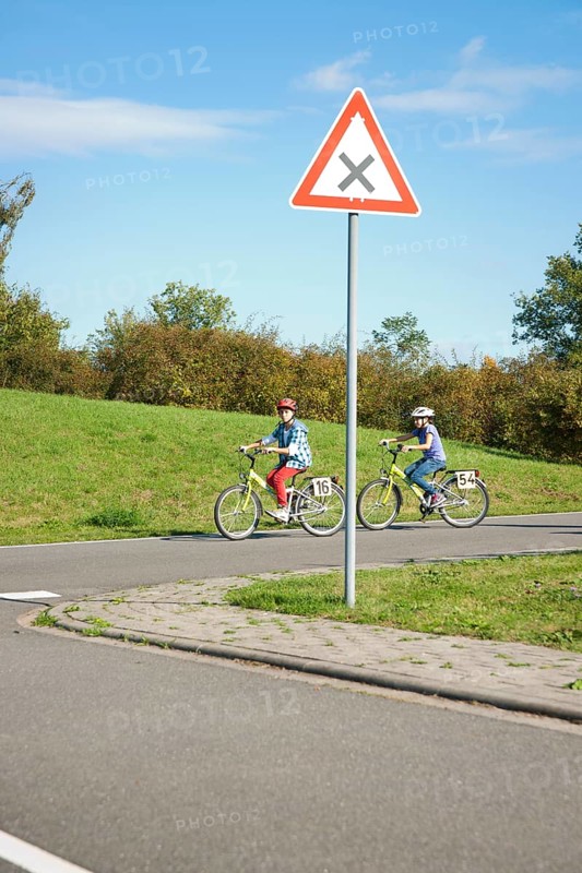 Children on bicycles at a traffic awareness course