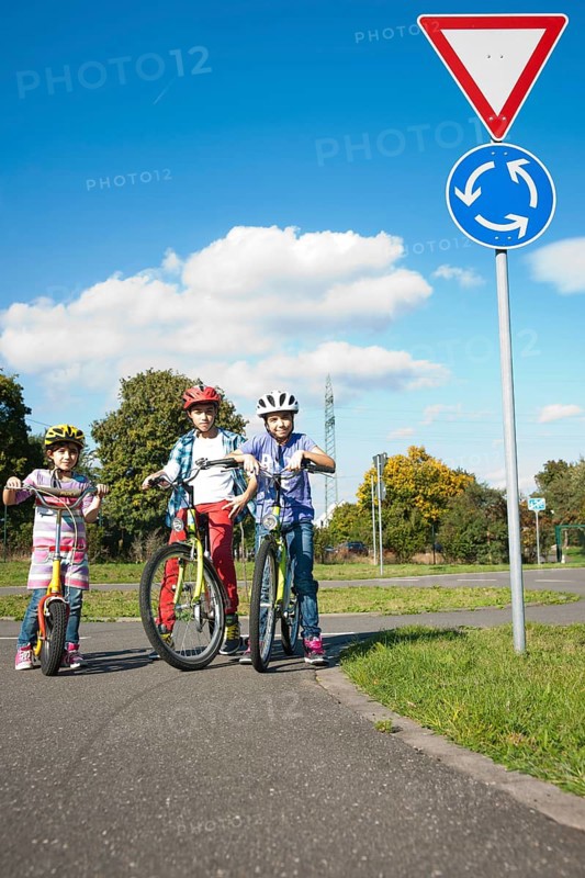 Children on bicycles at a traffic awareness course