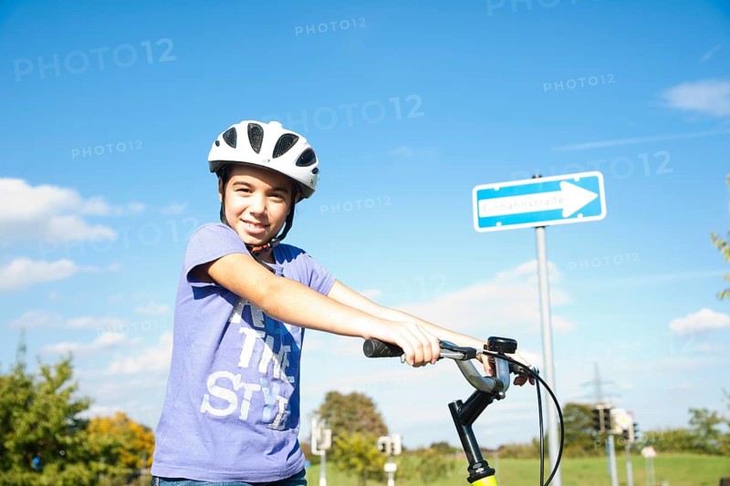 Girl wearing a bike helmet at a traffic awareness course