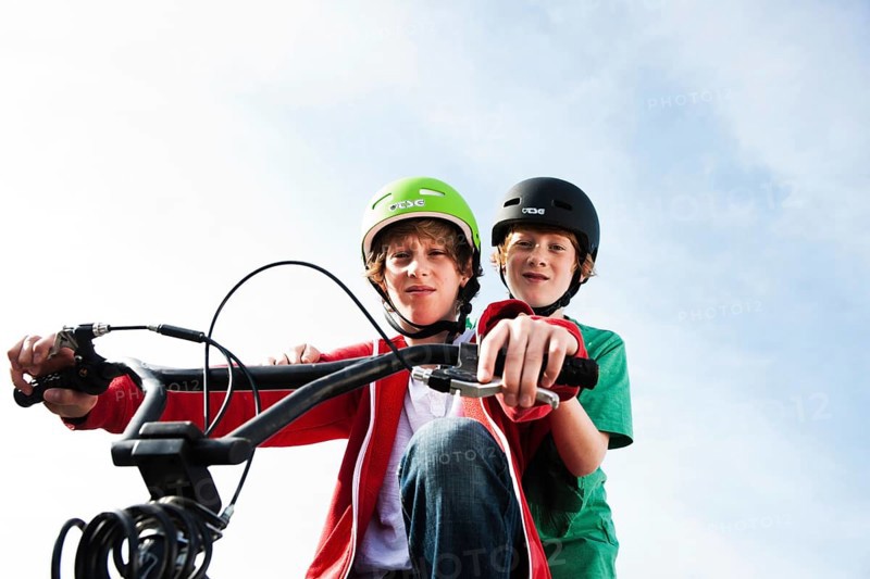 Two cool boys on a BMX bike