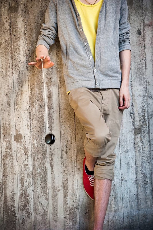 Young man playing with a yo-yo