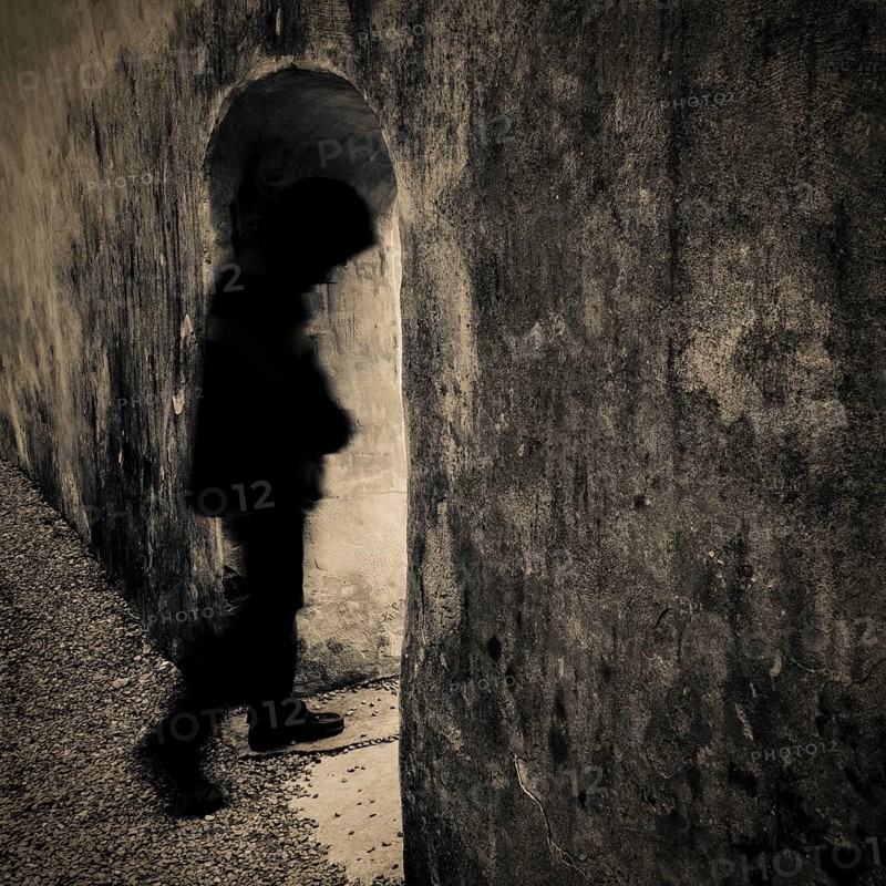 Person walking through archway