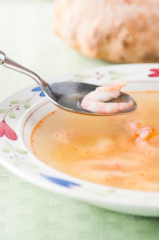 Bowl of soup with prawns