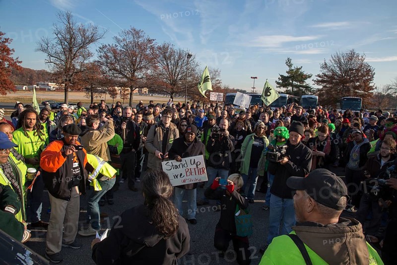 Walmart workers rally with supporters outside one of the company's stores on Black Friday