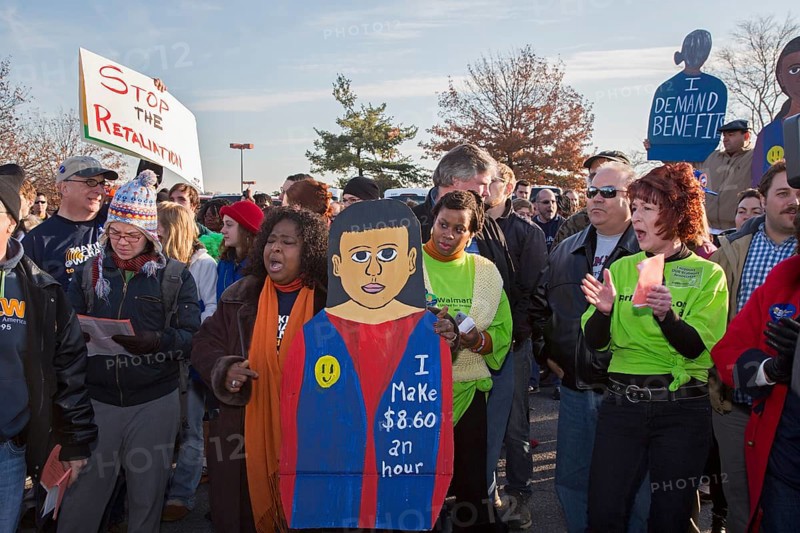 Walmart workers rally with supporters outside one of the company's stores on Black Friday