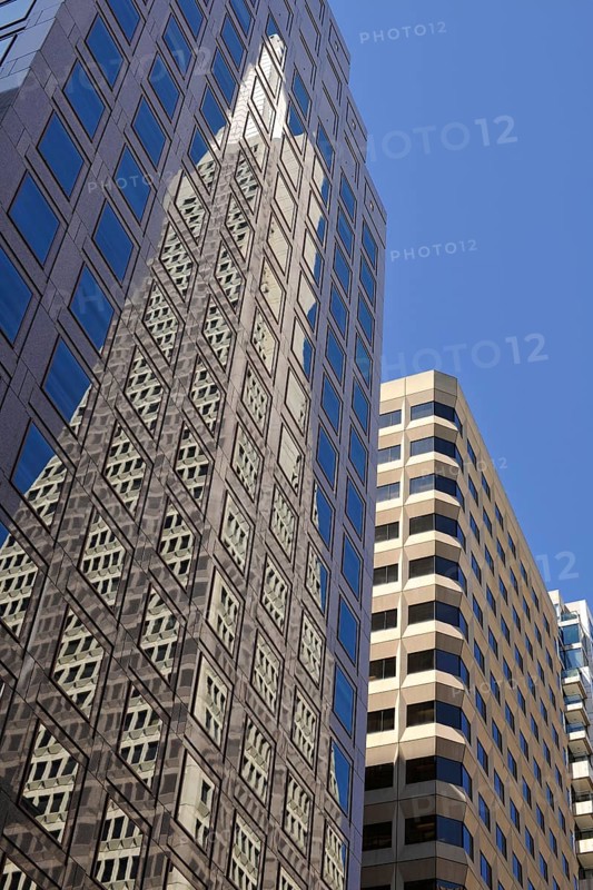 Reflection of the Transamerica Pyramid skyscraper in the East West Bank high-rise
