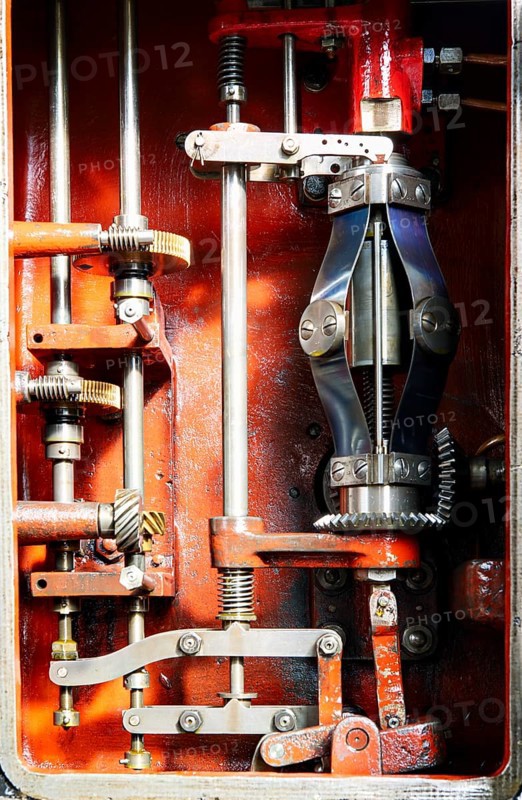 View into the open housing of a mechanical centrifugal governor for limiting the speed