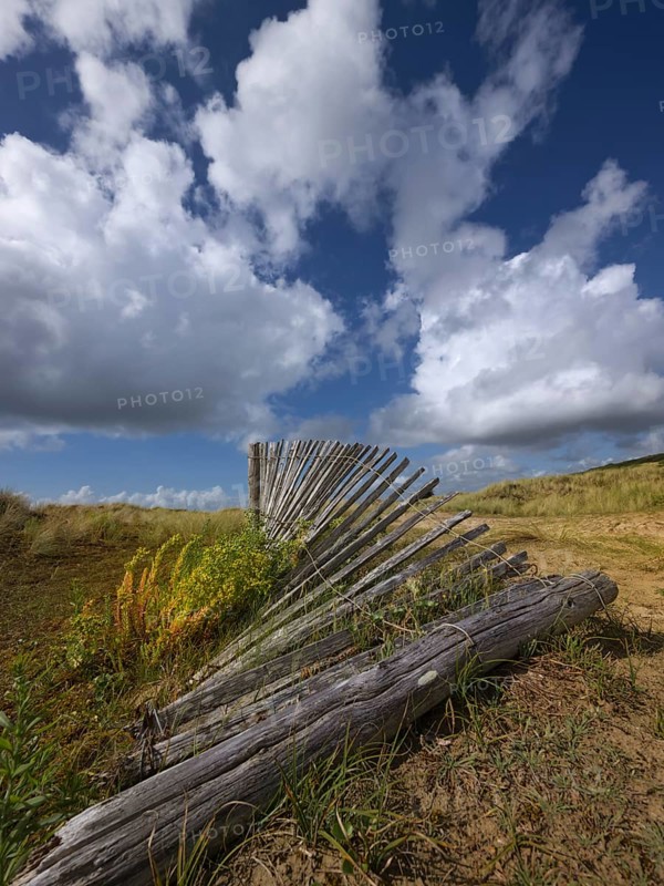 Damaged dune protection fence in the Bay of Douarnenez
