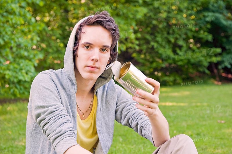 Young man sitting in nature
