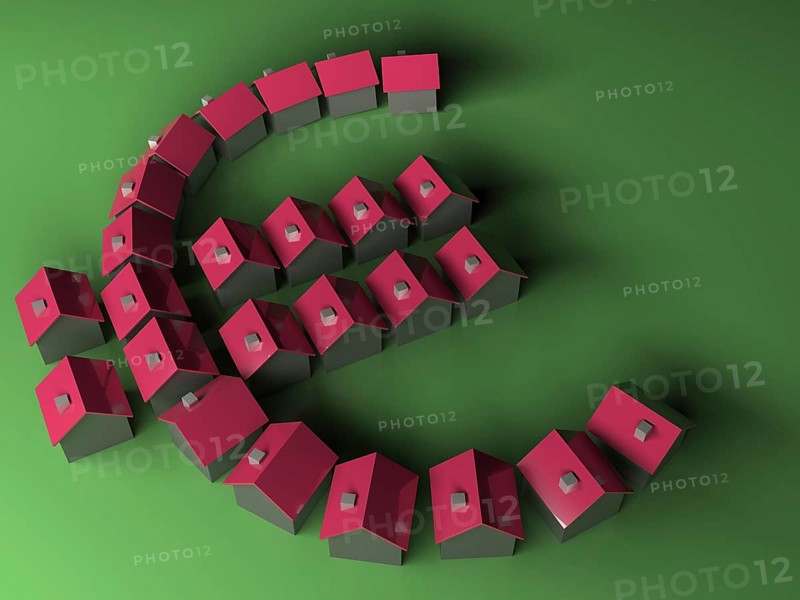 Small model houses forming the Euro symbol