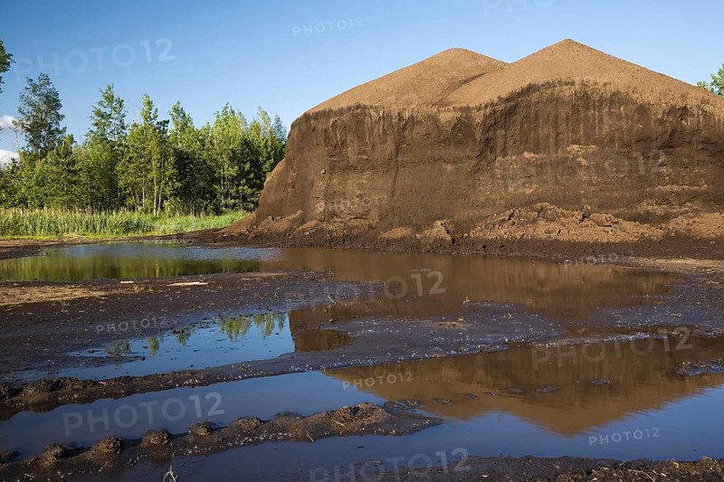 Mound of topsoil in a commercial sandpit after a heavy rainfall