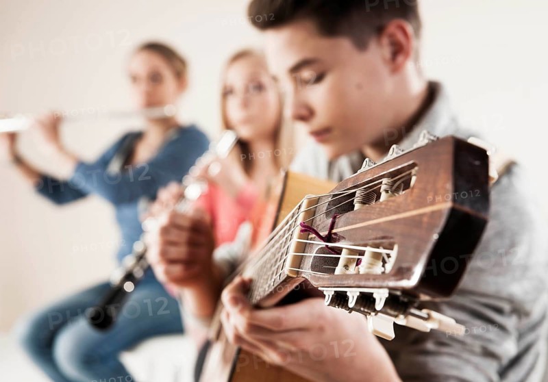 Teenagers making music together