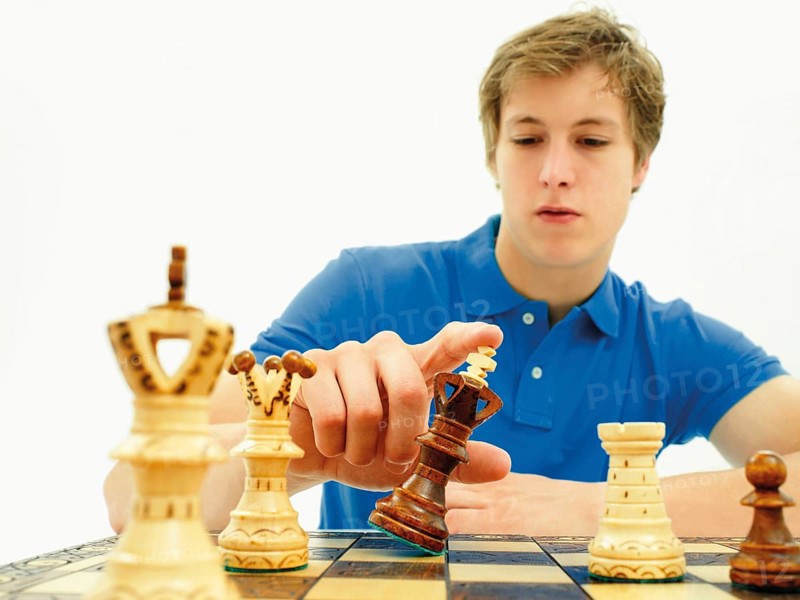 Young man playing chess
