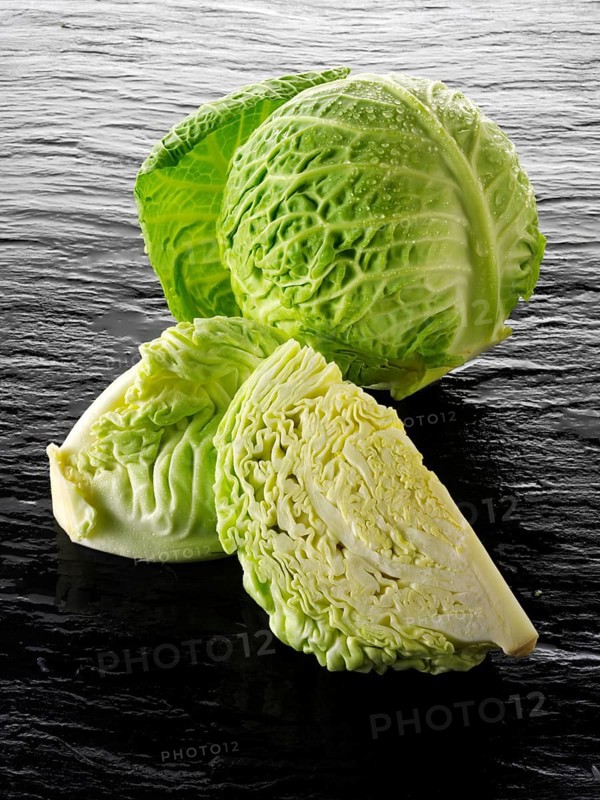 Whole and cut Savoy cabbage