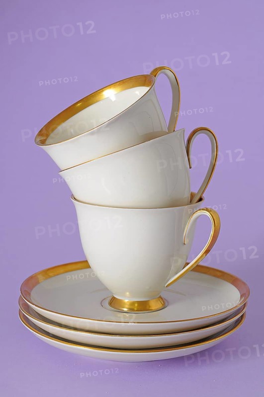 Antique coffee cups with a gold rim