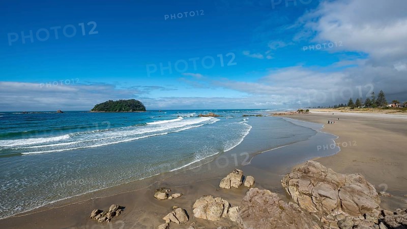 Sandy beach beach of Mount Manganui with peninsula Moturiki and island Motiti Island