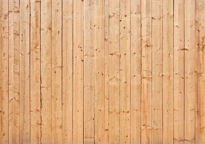 Natural colored wooden wall of rough boards