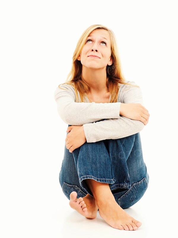 Woman sitting with bent knees