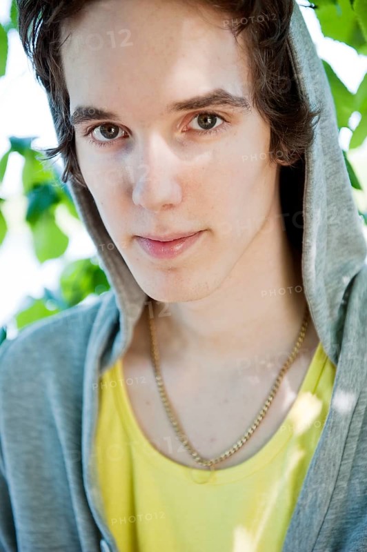 Portrait of young man wearing a hodded sweatshirt