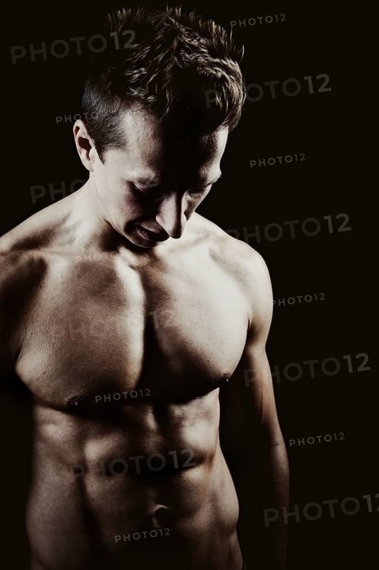 Young man with a muscular upper body