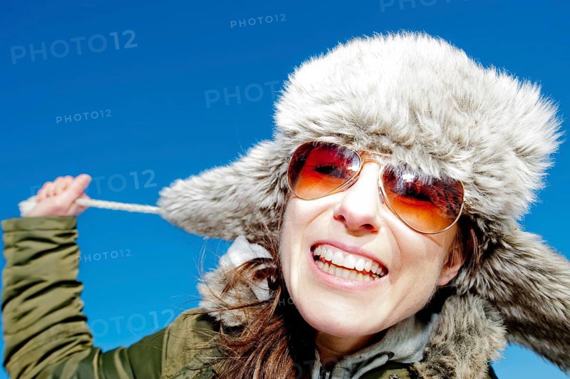 Happy woman wearing winter clothes