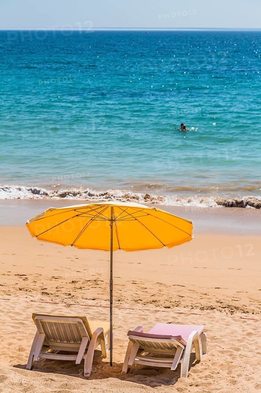 Parasol and sun beds