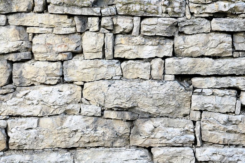 Old stone wall out of shell limestone
